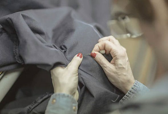 Detail of a seamstress working on a garment